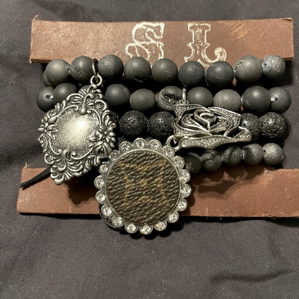 UPCYCLED stacker bracelet with charms from
LOUIS VOUITON bag by Sandra Lang